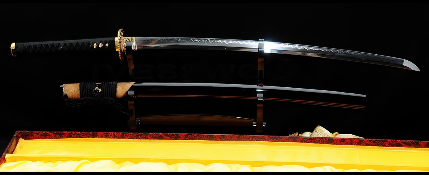 The unsheathed Golden Hawk Katana and its partial brown rayskin saya displayed on separate stands within a yellow-lined box.