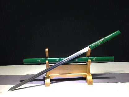 An alternate angle of the unsheathed Green Phantom Bamboo Blade, displaying the full straight blade and its saya.