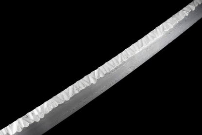 A detailed macro shot of the Ryū Tsuchime Katana's blade, showcasing the unique Tsuchime (hammer-marked) spine and the 1024-layer folded steel pattern (hada).