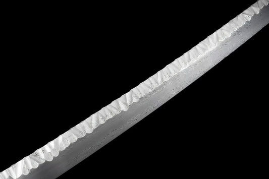 A detailed macro shot of the Ryū Tsuchime Katana's blade, showcasing the unique Tsuchime (hammer-marked) spine and the 1024-layer folded steel pattern (hada).