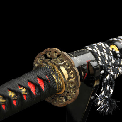 An alternate angle of the intricately sculpted brass "Great Wave" (Nami) theme tsuba.